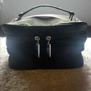Black Dior cosmetic bag